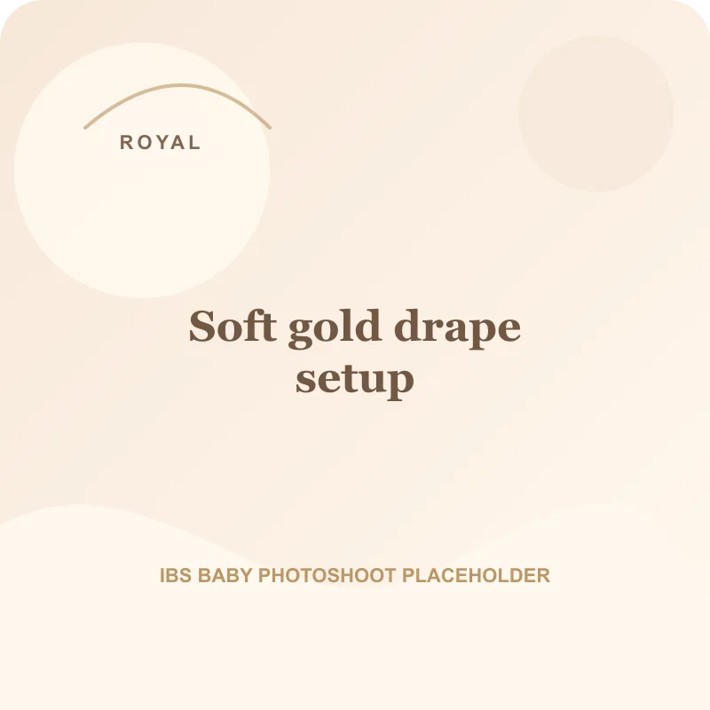 Soft gold drape setup for royal theme baby photoshoot Pune